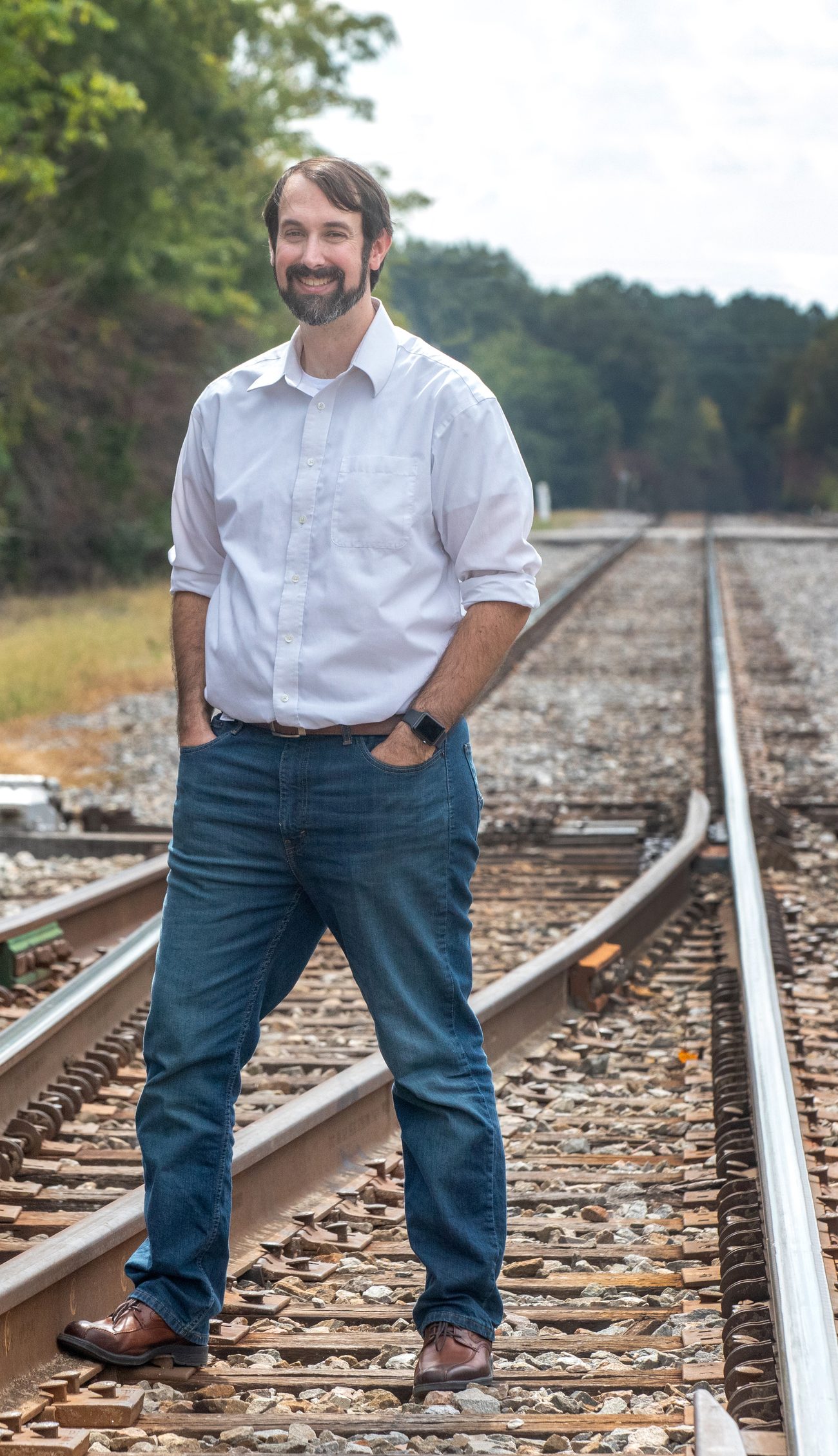 Jonathan Reeves standing on railroad tracks